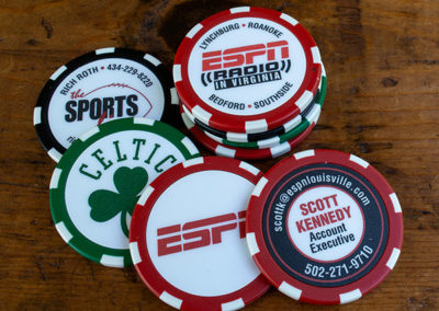 Sport themed custom poker chips stacked and spread out for ESPN Radio, The Sportsline, Celtics, and an account executive
