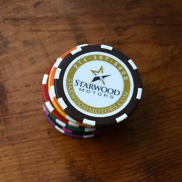 a stack of seven poker chips with a brown custom logo poker chip for Starwood Motors on top