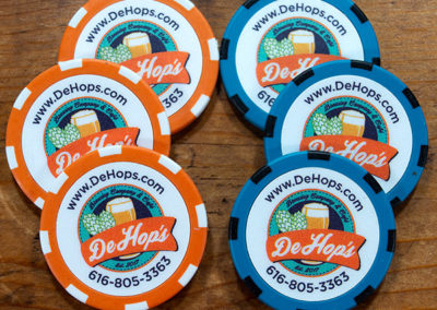 DeHops Brewing Company logo on three orange and three teal poker chips