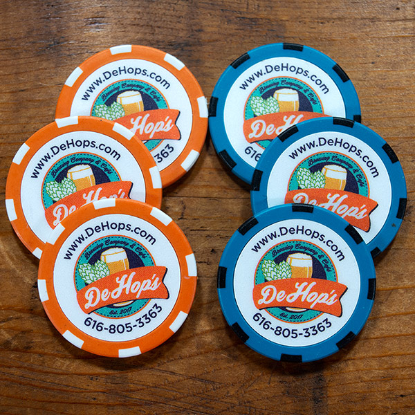 DeHops Brewing Company logo on three orange and three teal poker chips