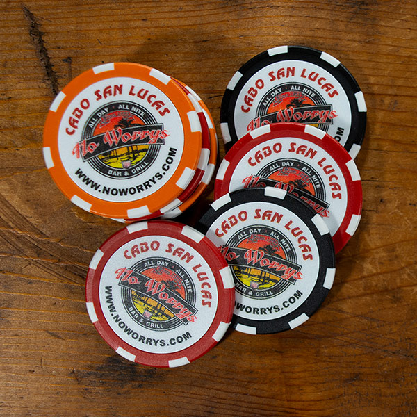 a stack of Cabo San Lucas No Worrys Bar & Grill custom logo poker chips in orange, red and black