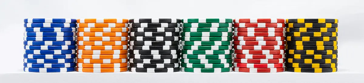 stacked up chips, lined to display different colors of custom poker chips